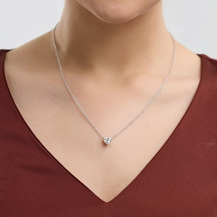 Floating heart-shaped lab-grown diamond pendant necklace in 14K white or yellow gold with F/G color and VS1 clarity.