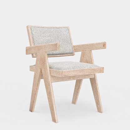 Pair of Raquel Side Chairs by Start2Finish with wooden legs and upholstered seats, shown in a modern dining setting.