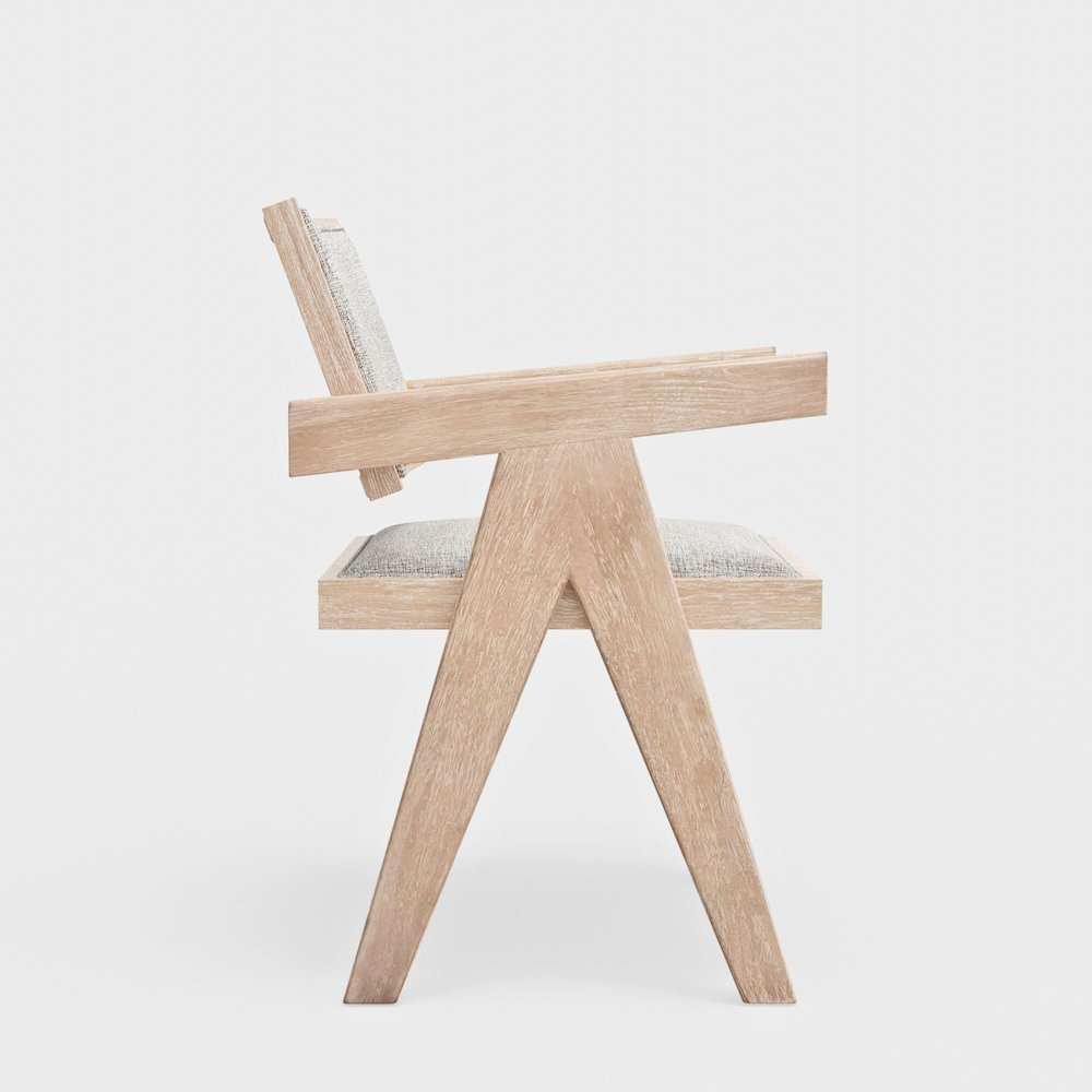 Set of 2 Raquel Side Chairs by Start2Finish with wooden legs and upholstered seats, shown in a modern living room setting.