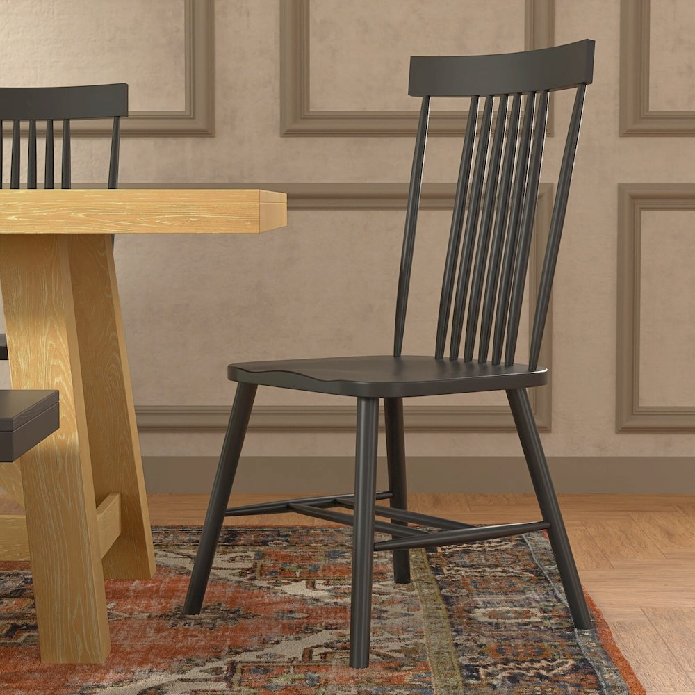 Black Eleanor side chair from Start2Finish, modern furniture with a sleek, padded seat and backrest, metal legs for stability.