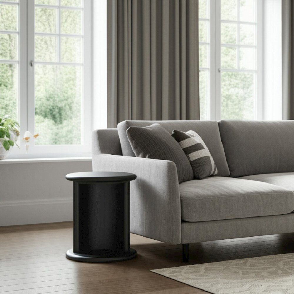 Black Gabrielle End Table by Start2Finish, showcasing a sleek modern furniture piece with a smooth surface and sturdy legs.