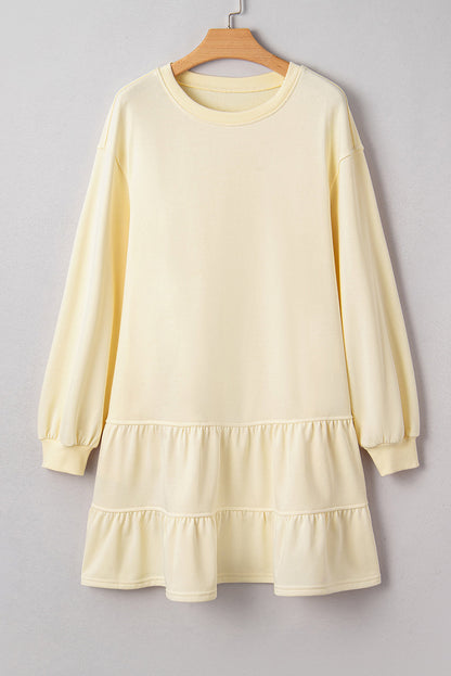 Solid tiered ruffle hem long sleeve dress by Byzantium Bay, featuring a flowing silhouette and layered ruffle details.