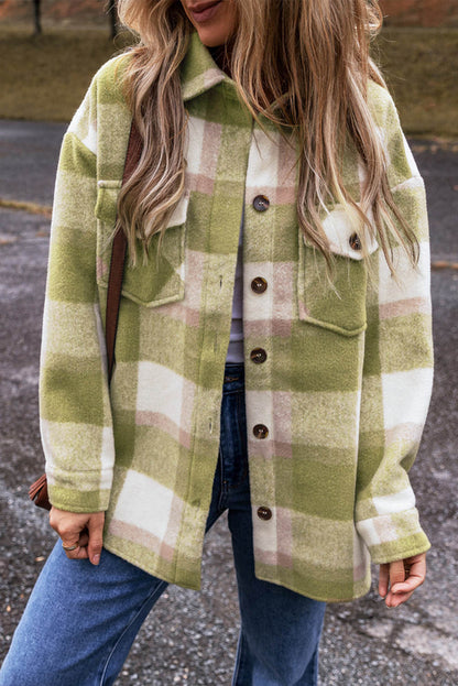 Sage green plaid print shacket with buttoned flap pockets from Carmine Juneberry, featuring a baggy, casual fit.