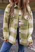 Sage green plaid print shacket with buttoned flap pockets from Carmine Juneberry, featuring a baggy, casual fit.