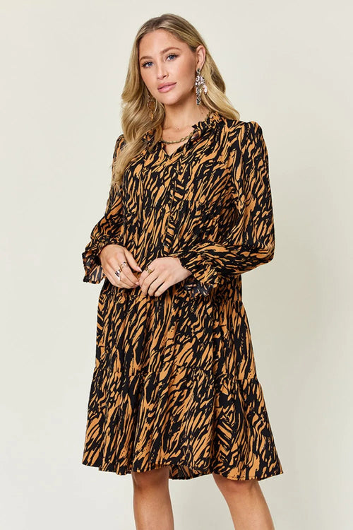Pear Daisy double take printed ruffle hem long sleeve dress, full size, stylish fashion piece with floral pattern and elegant ruffle details.