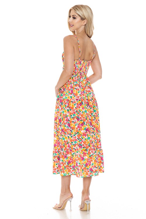 Women’s floral maxi dress by Jade Icarus featuring a flowing design and vibrant flower print, perfect for summer or casual wear.