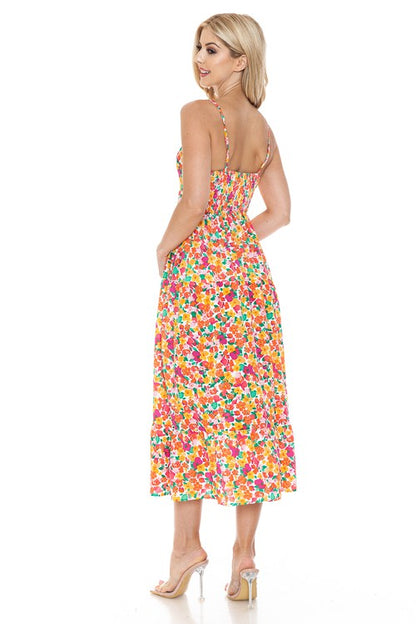 Women’s floral maxi dress by Jade Icarus featuring a flowing design and vibrant flower print, perfect for summer or casual wear.