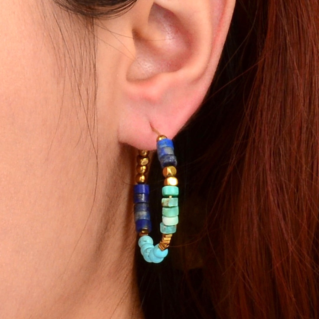 Blue turquoise and lapis gemstone gold hoop earrings, stylish jewelry with vibrant blue stones and polished gold hoops.