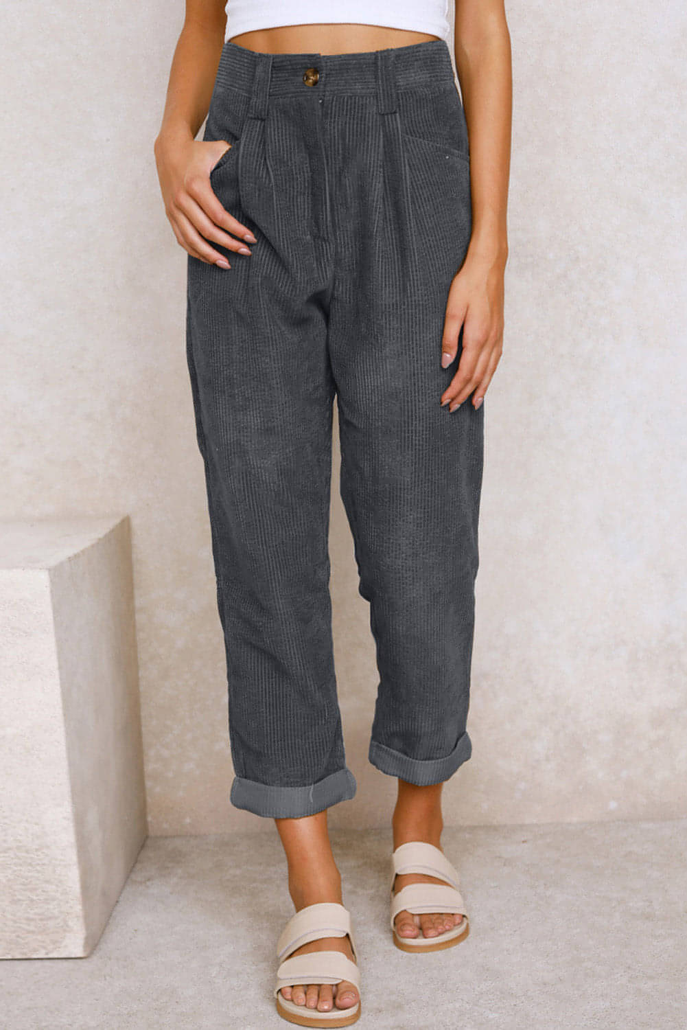Gray corduroy high waist straight leg pants by Carmine Juneberry, showing the textured fabric and tailored fit.