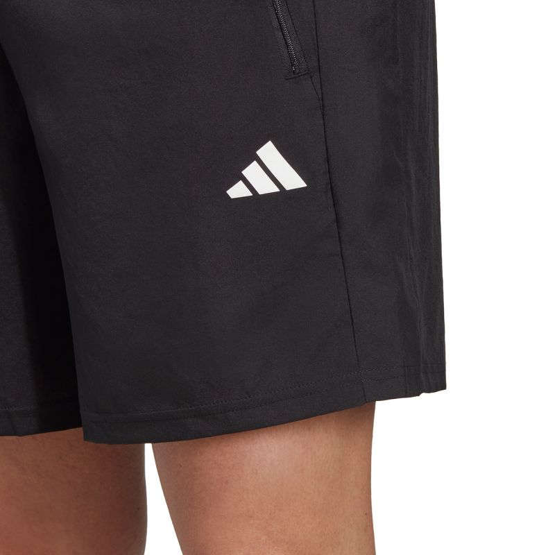 Adidas Train Essentials woven shorts for men, featuring lightweight fabric and a comfortable fit, shown in a navy color.
