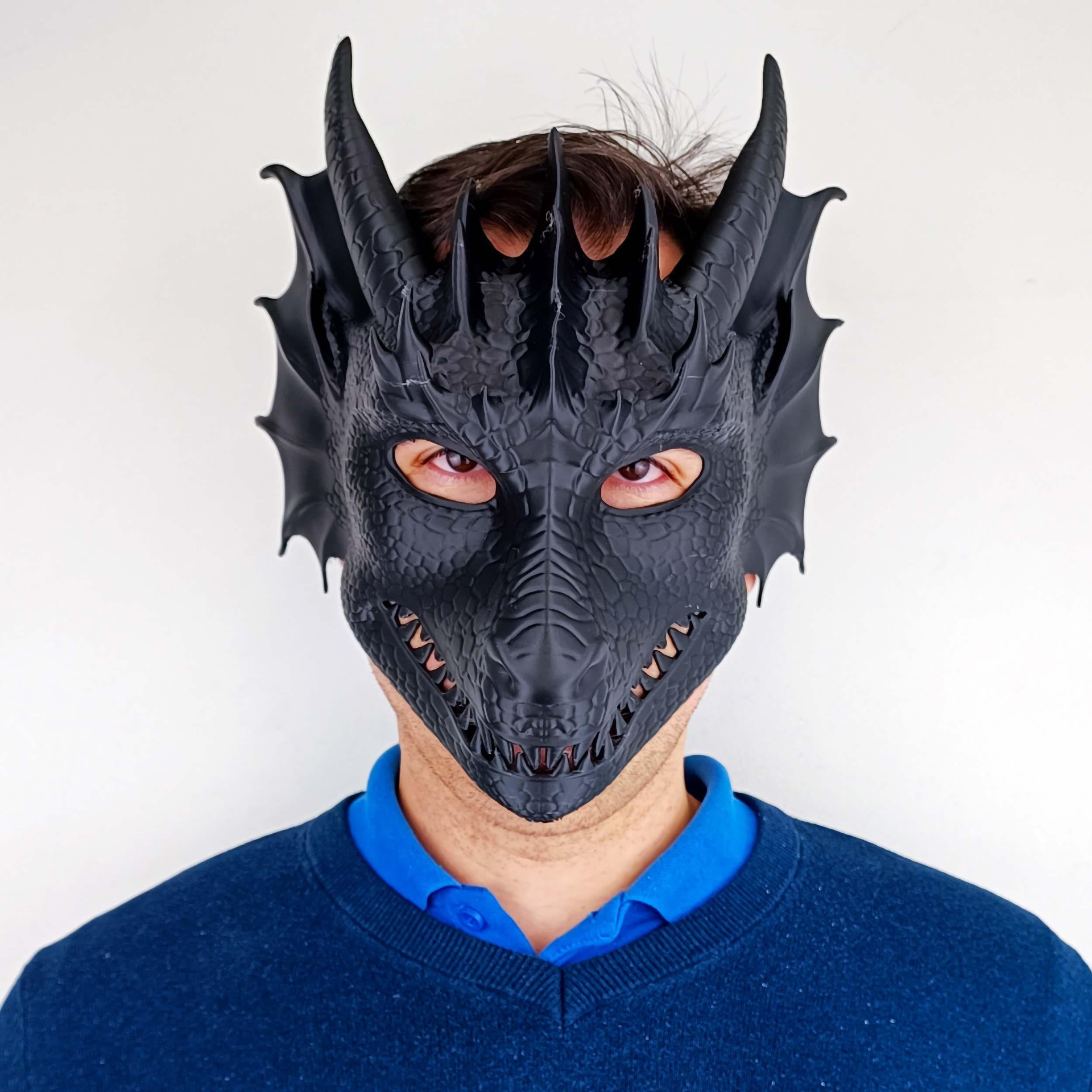 3D printed dragon mask from Start2Finish, a fantasy cosplay mask of a mythical creature with adjustable fit, detailed dragon design.