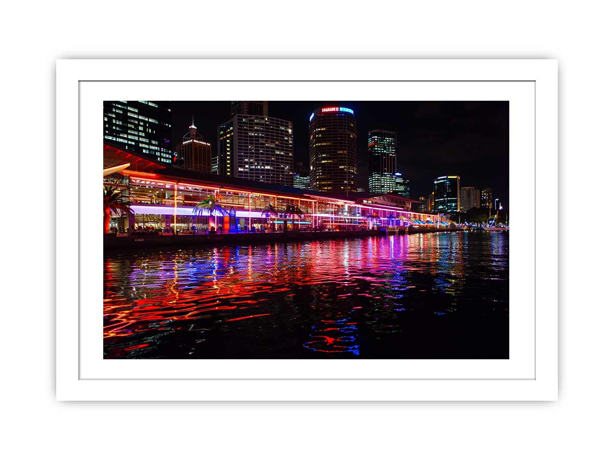 Framed print of Darling Harbour Sydney at night by Start2Finish, showcasing the vibrant cityscape and waterfront lights.