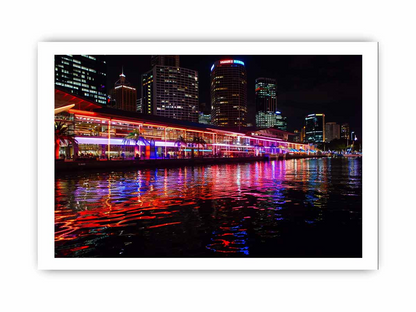 Framed print of Darling Harbour Sydney at night, featuring city skyline and illuminated buildings, from Start2Finish home decor collection