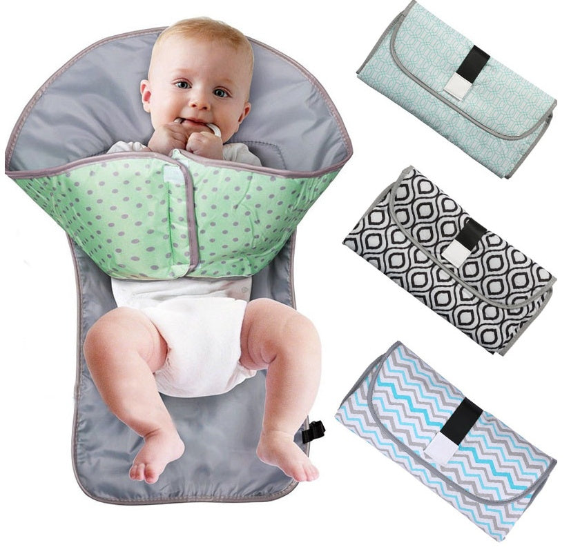 Soft, portable baby changing pad from CJDropshipping with padded surface and secure straps for comfortable diaper changes.
