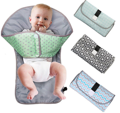 Soft, portable baby changing pad from CJDropshipping with padded surface and secure straps for comfortable diaper changes.