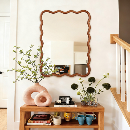 Wavy solid wood wall mirror with a curved frame, ideal for bathroom, bedroom, or entryway decor, by Start2Finish.