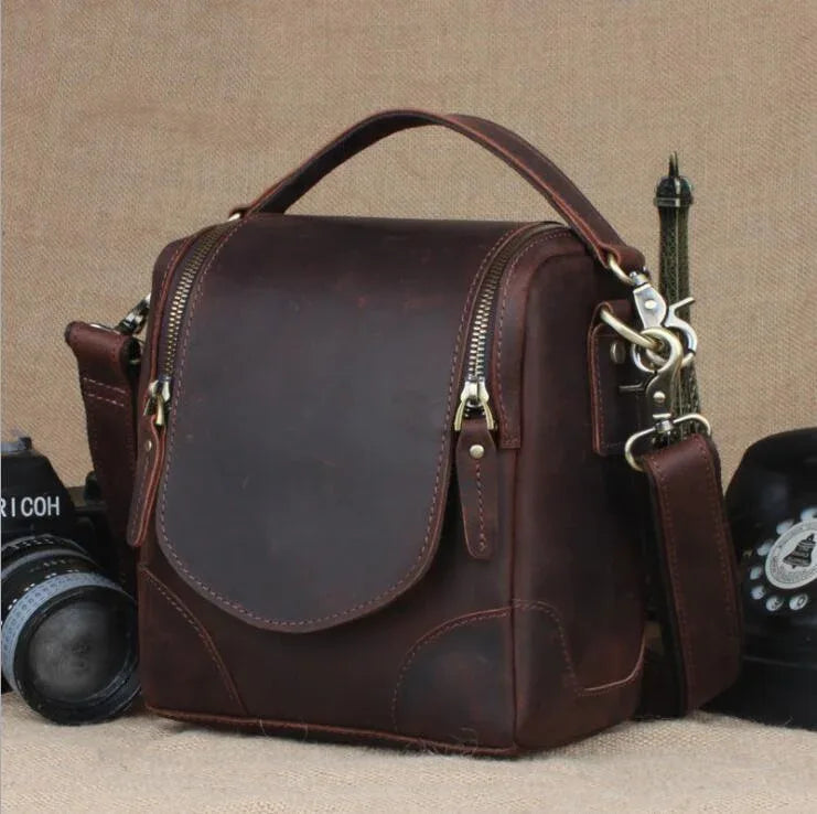 Small leather camera bag and lens case by Start2Finish, features compact design with leather exterior and adjustable strap.