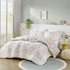 Start2Finish floral reversible cotton comforter set with matching throw pillow, featuring vibrant floral patterns on bedding and pillow.