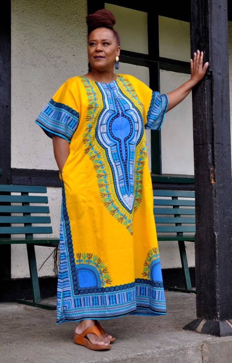 White Baobab African Dashiki dress, long kaftan style T-shirt with vibrant colorful African print and traditional design.