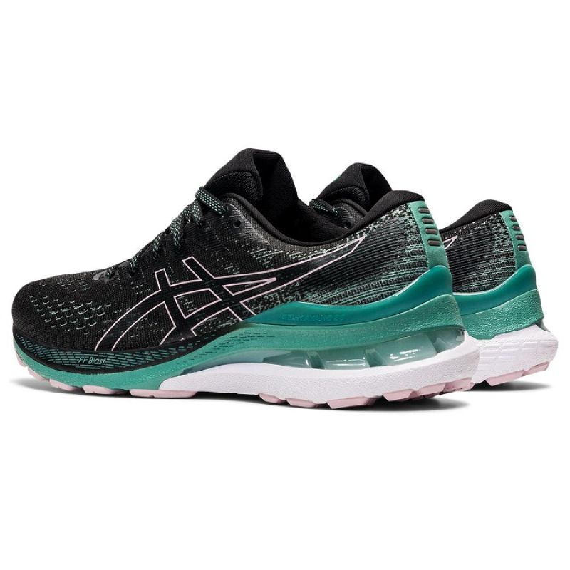 Asics Gel Kayano 28 W running shoes in black and white with cushioned soles, designed for comfort and support.