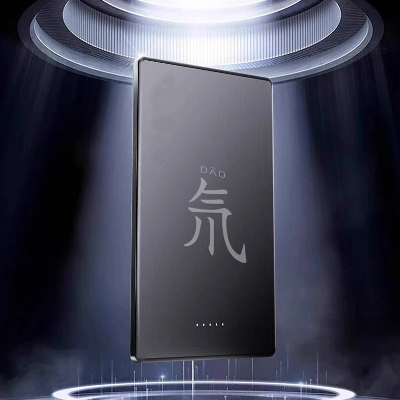Gray titanium power bank with magnetic alloy shell, portable tech accessory by Gold Penelope, showing sleek design and compact size.