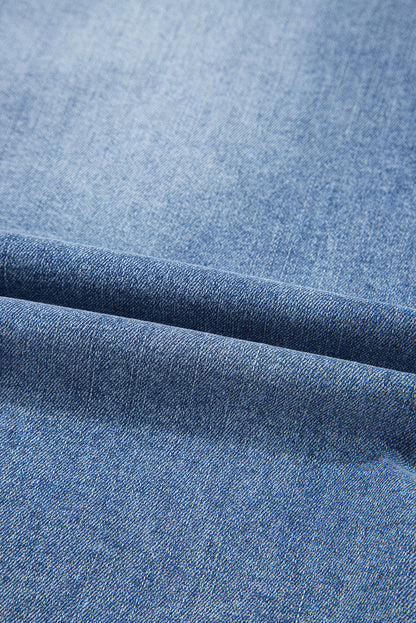 Distressed denim midi skirt for women by Byzantium Bay, featuring a casual, trendy style with frayed hem and classic blue wash.