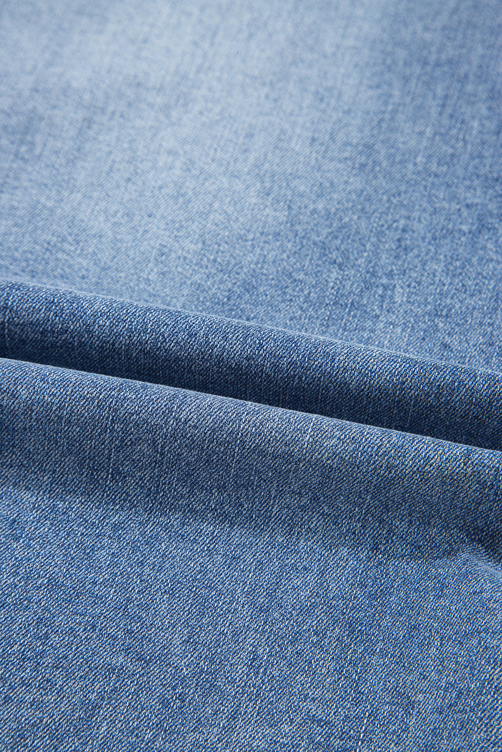 Distressed denim midi skirt for women by Byzantium Bay, featuring a trendy, casual style with ripped details and a mid-length fit.