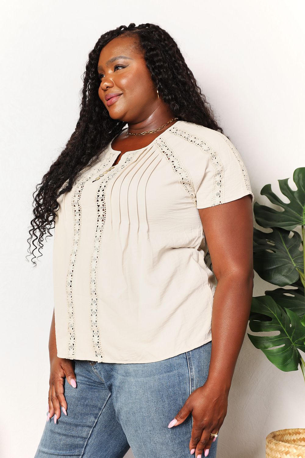 Pear Daisy double take crochet buttoned short sleeves top with intricate crochet pattern and button details, perfect for casual wear.