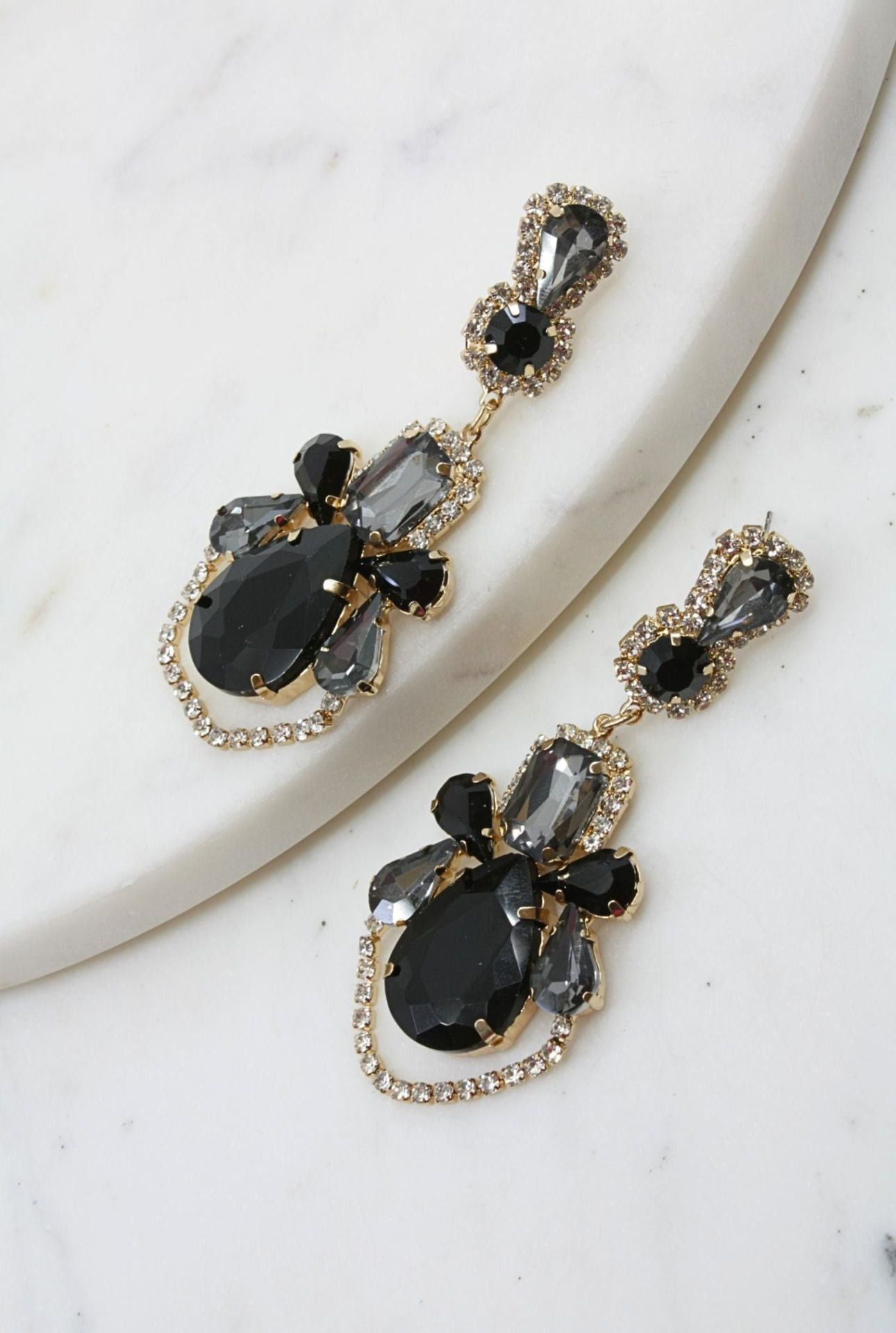 Black fancy geometric earrings from Start2Finish jewelry collection, featuring bold angular designs and sleek black finish.