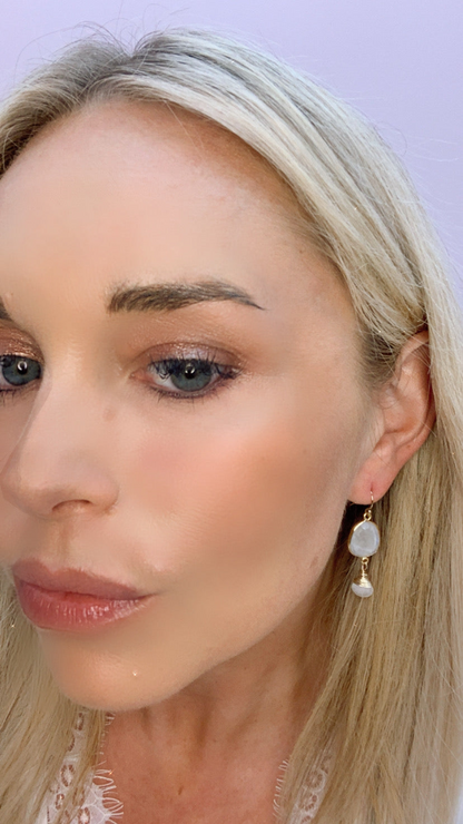 Victoria earrings in moonstone featuring elegant jewelry design with shimmering, translucent moonstone gemstones and sterling silver settings.