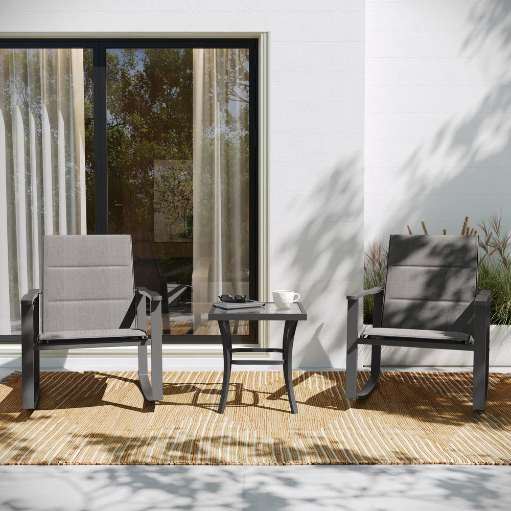 Set of three modern outdoor rocking chairs with matching table by Start2Finish, featuring sleek design and comfortable seating.