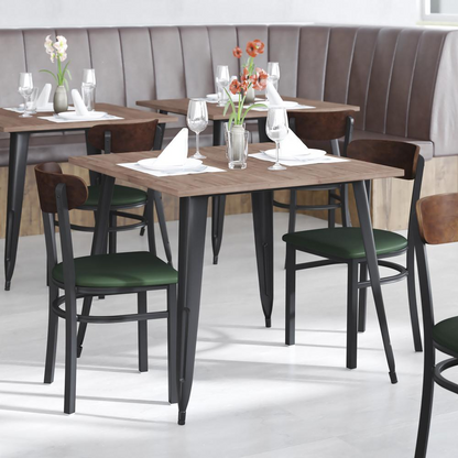 Start2Finish commercial dining chair with vinyl upholstered seat and wood boomerang back, shown in a modern restaurant setting.