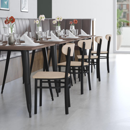 Commercial dining chair with vinyl upholstered seat and wood boomerang back, featuring a sturdy frame and stylish design.