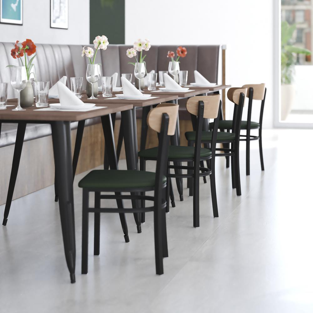 Start2Finish commercial dining chair with vinyl upholstered seat and wood boomerang back, shown from a side angle.