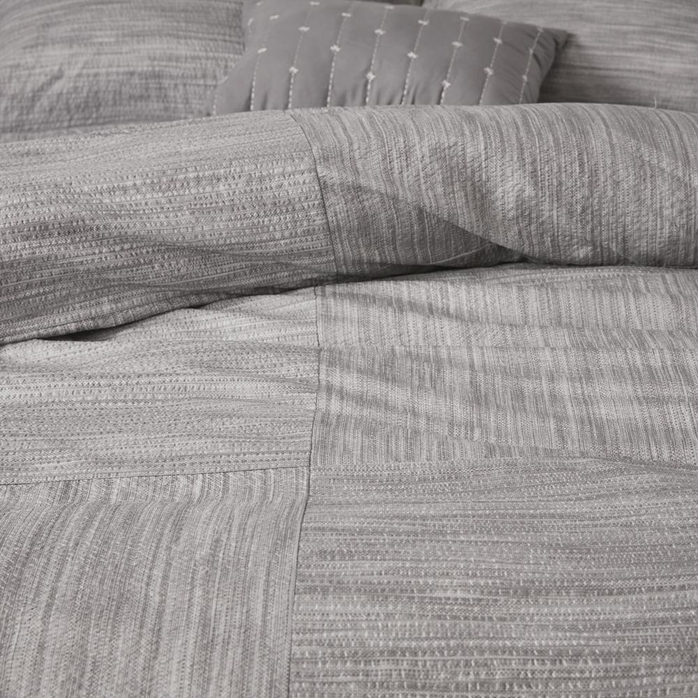 Start2Finish 7-piece printed seersucker comforter set featuring colorful patterns and matching pillow shams on a cozy bed.
