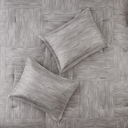 Walter 7-piece printed seersucker comforter set in grey by Start2Finish, featuring matching pillow shams and bedding details.
