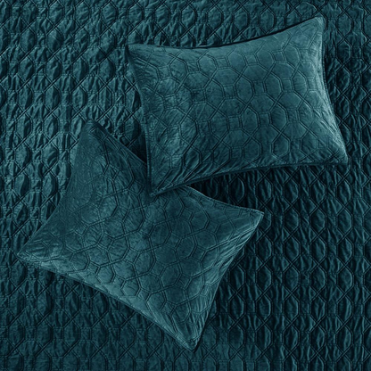 Start2Finish Harper 3-piece velvet quilt set in teal with matching pillow shams on a bed for cozy bedroom decor.