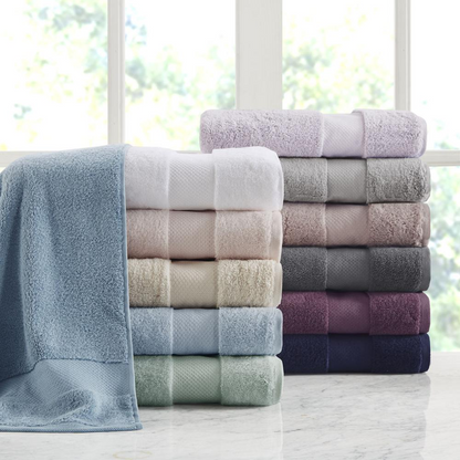 Start2Finish cotton 6-piece bath towel set with soft, plush towels in neutral colors laid out on a bathroom countertop.