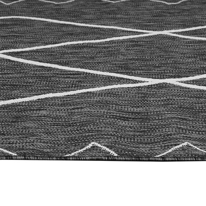 Start2Finish Moroccan indoor/outdoor rug with intricate geometric patterns in vibrant colors on a textured surface.