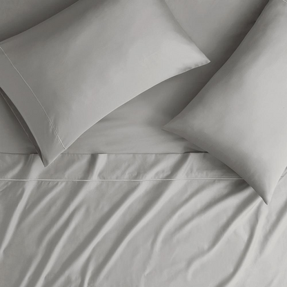 Start2Finish Pima Cotton Sheet Set with smooth, white bed sheets and pillowcases for a comfortable, luxurious sleep experience.