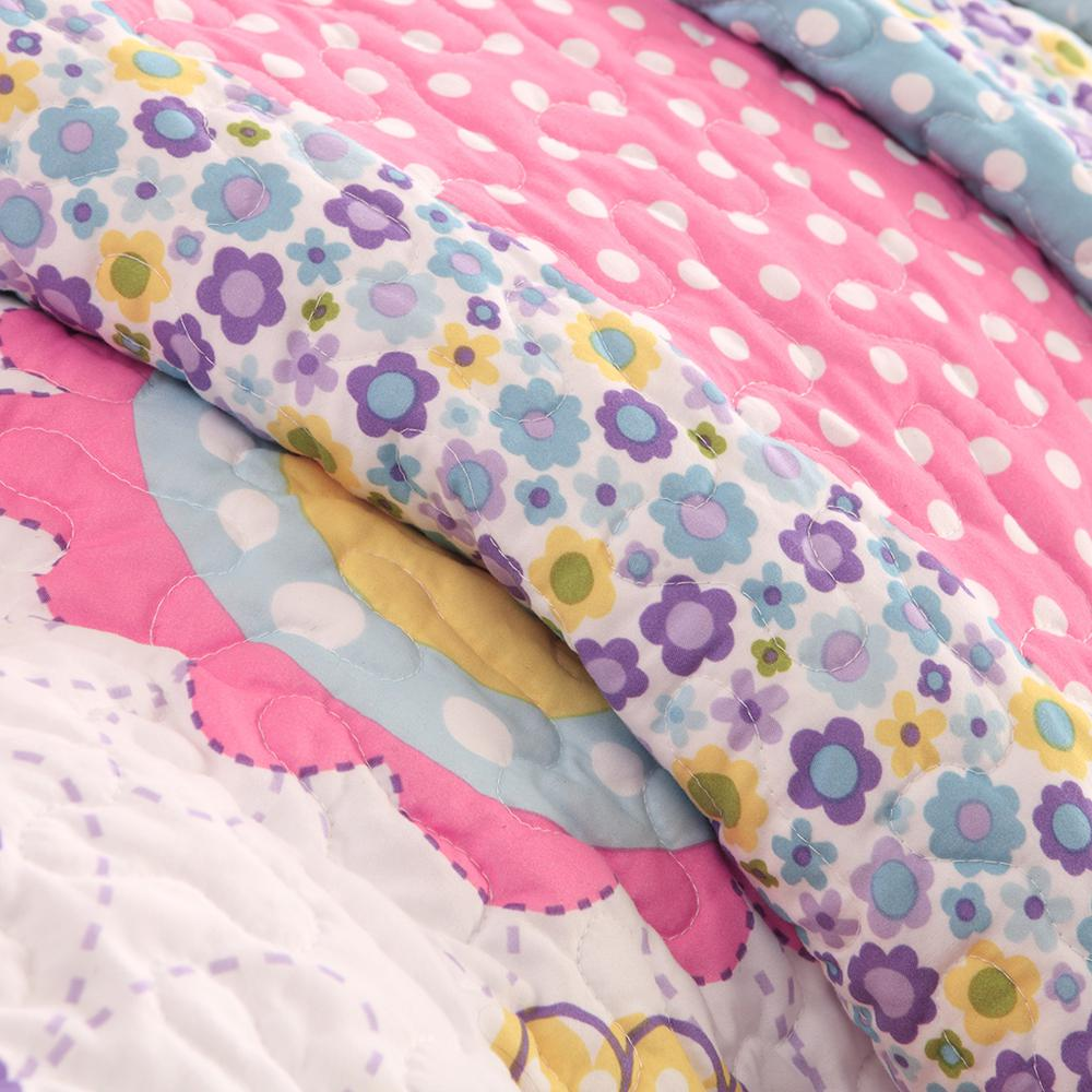 Reversible quilt set with matching throw pillow featuring colorful patterns, made by Start2Finish for cozy bedroom decor.