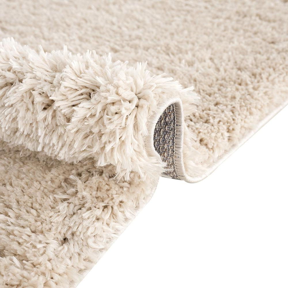 Start2Finish super soft polyester shag area rug with plush, thick pile and textured surface in warm neutral tones.
