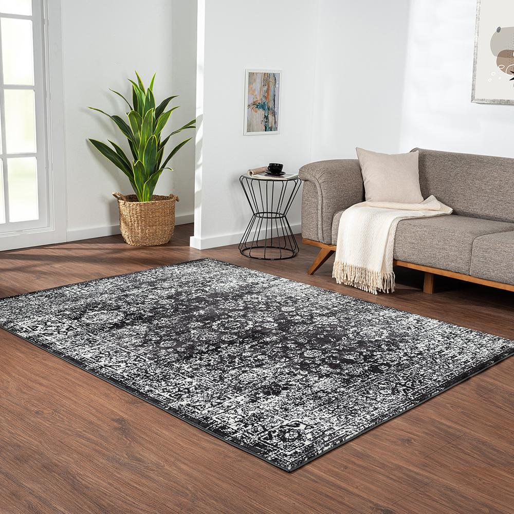 Distressed vintage Persian woven area rug with intricate patterns and muted colors, handcrafted by Start2Finish.