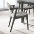Set of two Start2Finish Stevie padded wood dining arm chairs in black with cushioned seats and armrests.
