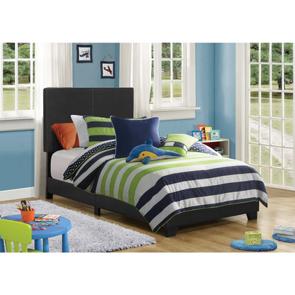 Black Dorian upholstered twin panel bed by Start2Finish with padded headboard and sleek design, shown in a modern bedroom setting.