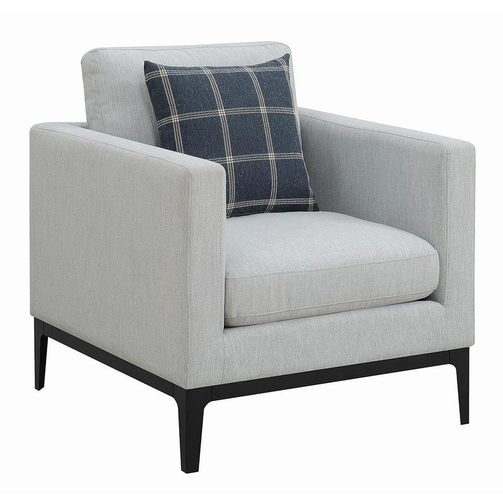 Light grey upholstered Apperson accent chair with track arms and wooden legs, styled as a modern furniture piece.