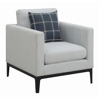 Light grey upholstered Apperson accent chair with track arms and wooden legs, styled as a modern furniture piece.