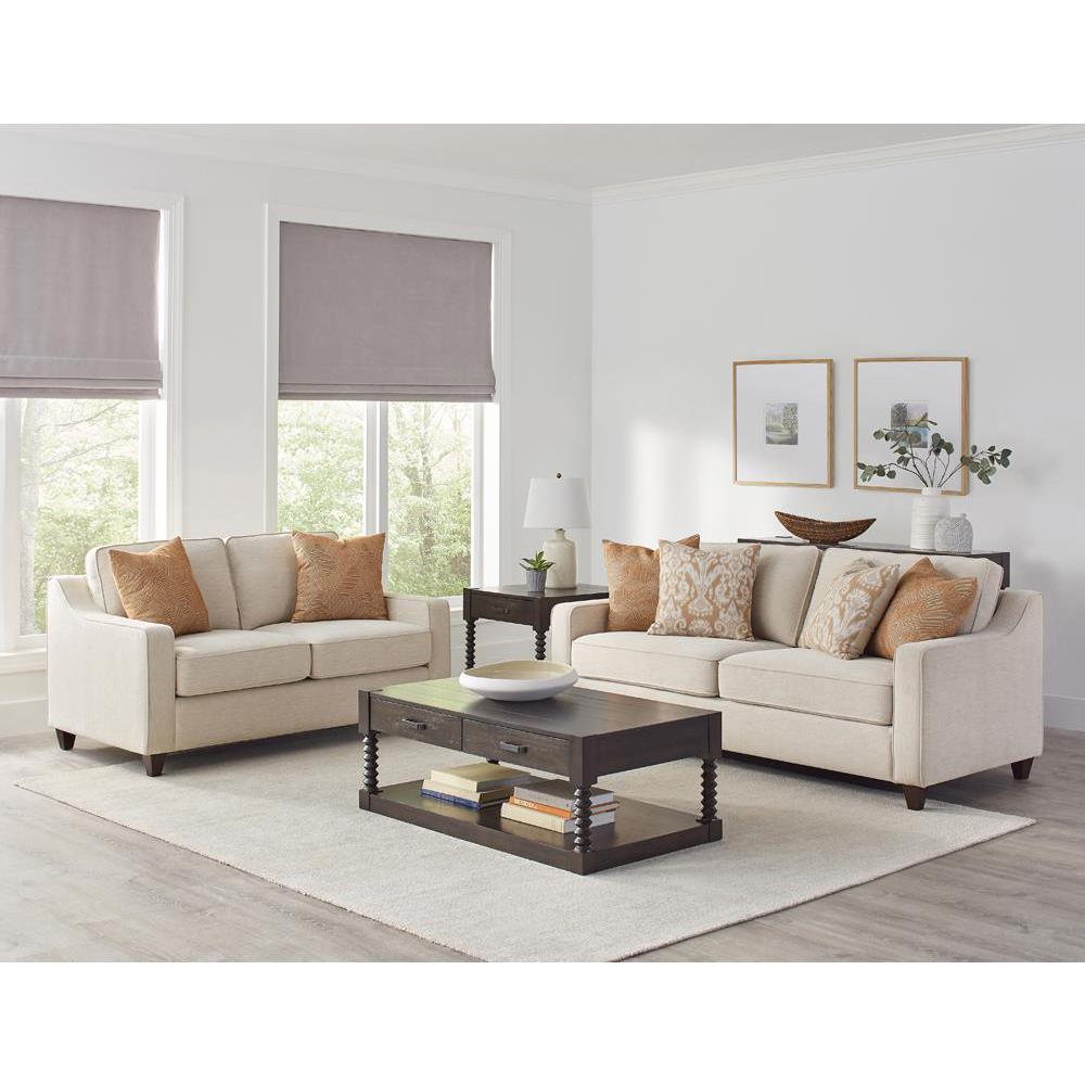 Beige Christine upholstered loveseat with sloped arms, featuring plush fabric and comfortable cushioning for cozy living spaces.