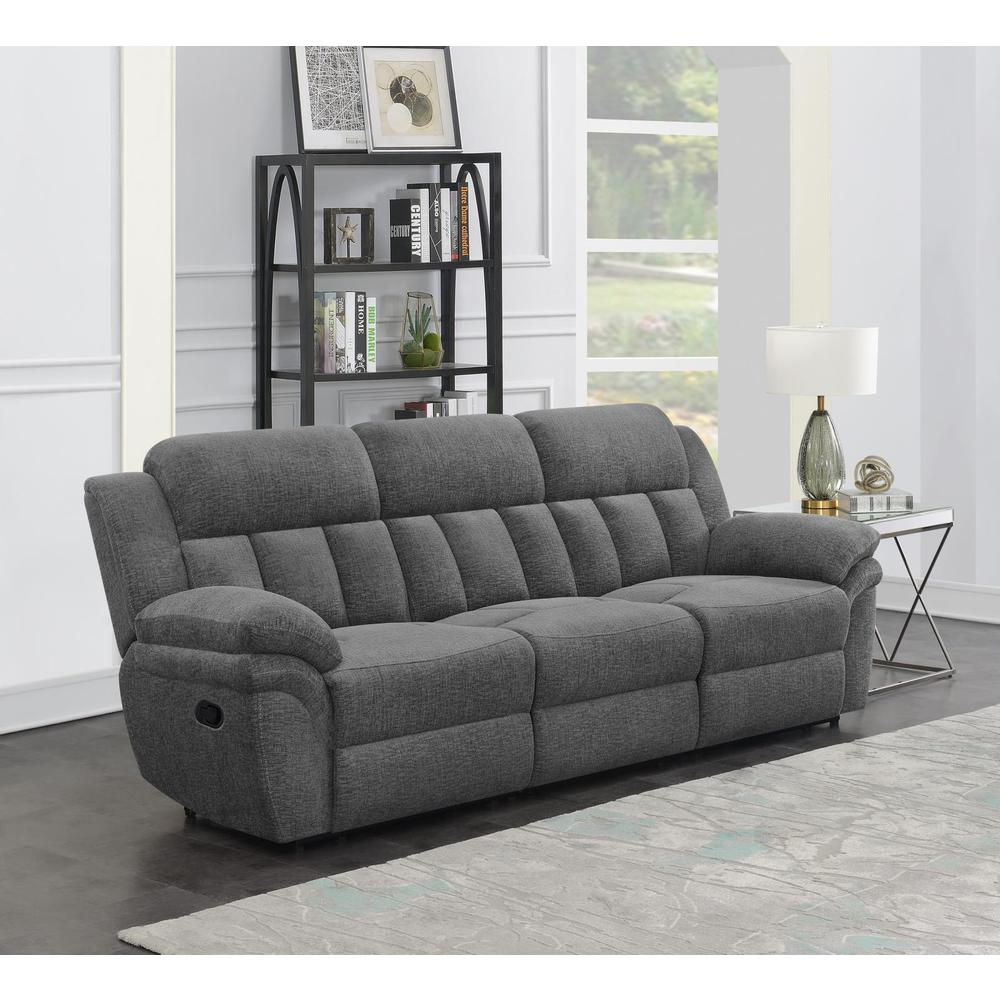 Start2Finish Bahrain upholstered motion sofa in charcoal fabric with plush cushions and modern design.
