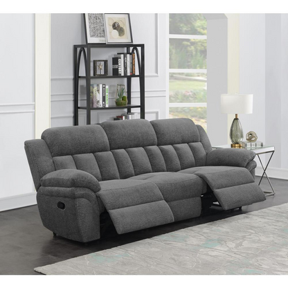 Charcoal Bahrain upholstered motion sofa by Start2Finish with plush cushions and modern design, shown in a living room setting.